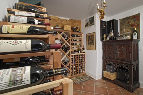 The above ground wine “cellar,” a climate-controlled room with built-in shelving, was the couple's innovative solution for wine storage.